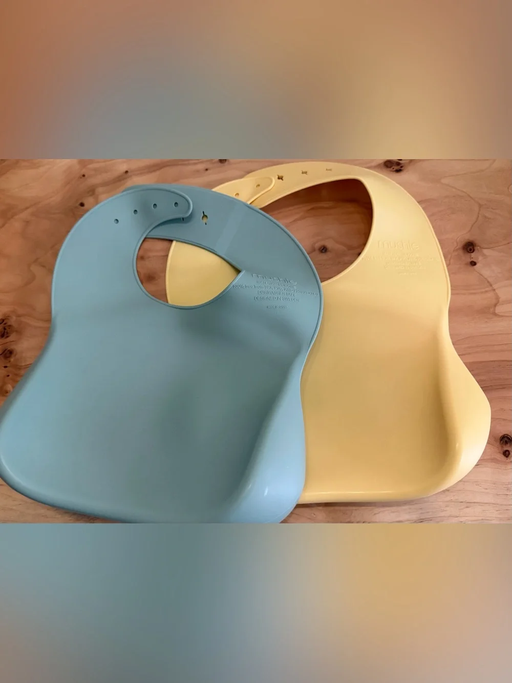 Mushie Adjustable Silicone Bibs for Toddlers in Sage Green and Pale Yellow